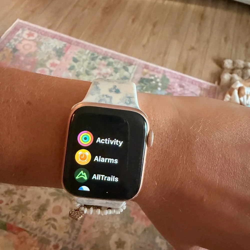 Rose Gold Apple Watch Series 4 - comes with charger, 3 bands shown